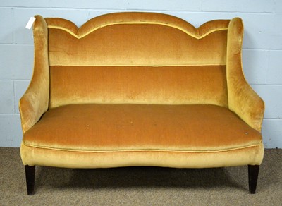 Lot 20 - An early 20th Century gold plush upholstered serpentine fronted settee.