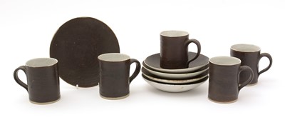 Lot 425 - Lucie Rie set of five coffee cans and saucers.