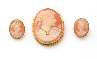 Lot 161 - A carved shell cameo brooch, and matching earrings
