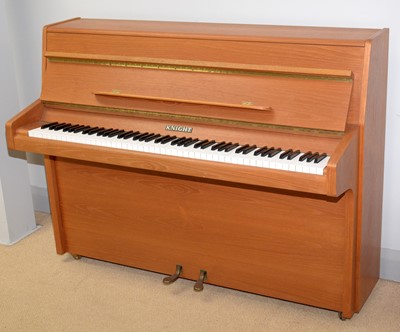 Lot 123 - A Knight teak framed upright piano.