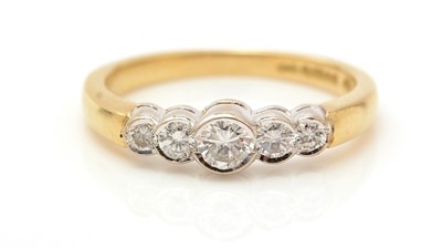 Lot 416 - A five stone diamond ring