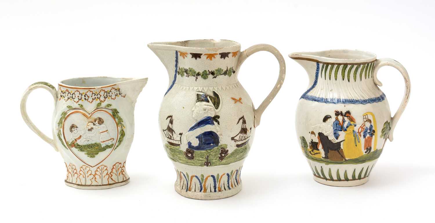 Lot 706 - Three Prattware jugs