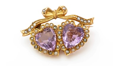 Lot 422 - An Edwardian amethyst and seed pearl brooch
