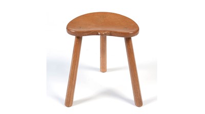 Lot 1283 - Workshop of Robert ‘Mouseman’ Thompson (Kilburn): an oak cow stool.