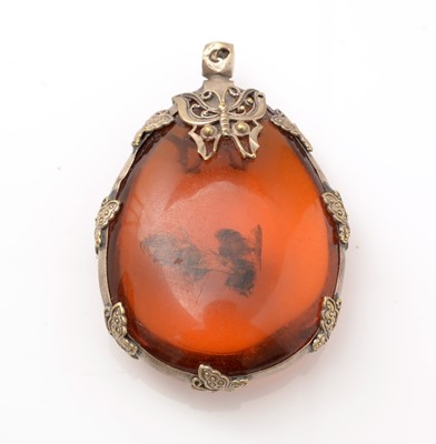 Lot 187 - An amber specimen pendant