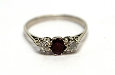 Lot 166 - A diamond and ruby three-stone ring