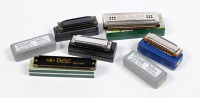 Lot 14 - seven Harmonicas