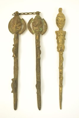 Lot 471 - A pair and a single Edan Ogboni staffs/rods