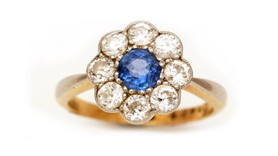 Lot 443 - A sapphire and diamond cluster ring