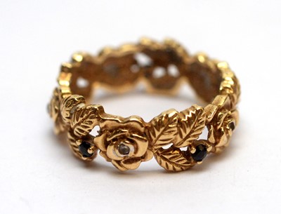Lot 162 - A 14ct yellow gold eternity ring of rose design