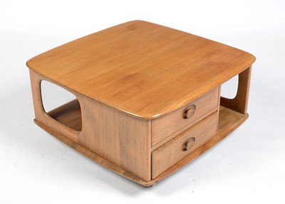 Lot 352 - Ercol: a light elm ‘Pandora’ model no 735 square coffee table with two drawers.