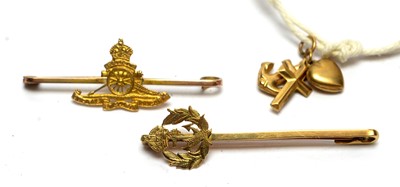 Lot 135 - Two sweetheart brooches and three charms