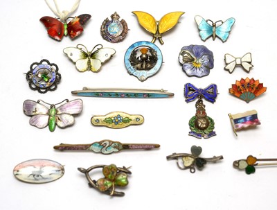 Lot 134 - A selection of silver and enamel brooches, and others