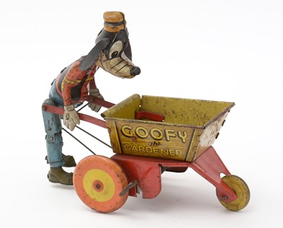 Lot 336 - Marx for Walt Disney Productions: a tin plate lithograph printed clockwork Goofy the Gardener toy