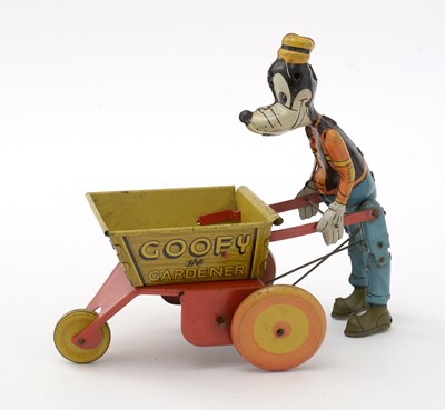 Lot 337 - Marx for Walt Disney Productions: a tin plate lithograph printed clockwork Goofy the Gardener toy