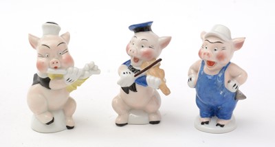 Lot 338 - Genuine Walt Disney copyright ceramic Three Little Pigs toothbrush holders