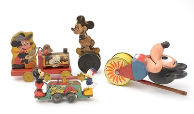 Lot 352 - Four Mickey Mouse pull/push along toys