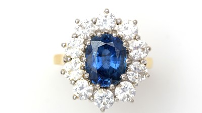 Lot 469 - A sapphire and diamond cluster ring