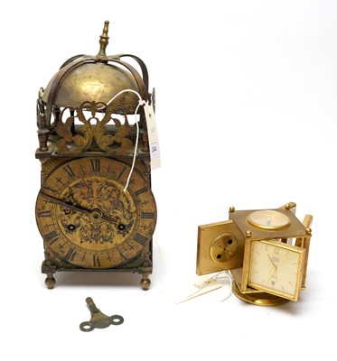 Lot 244 - An Imhof lacquered brass combination timepiece
