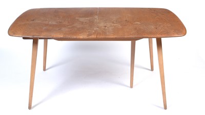 Lot 29 - Ercol: a Windsor elm and beech extending dining table.