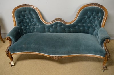 Lot 50 - An attractive Victorian carved walnut two seat button-back sofa