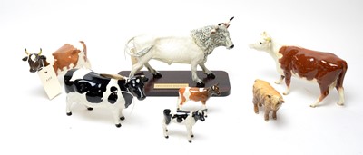Lot 361 - A collection of Beswick and other ceramic cow figures.