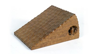 Lot 1267 - Workshop of  Robert ‘Mouseman’ Thompson (Kilburn): an unusual oak cheese wedge paperweight.