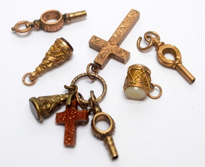 Lot 126 - A selection of gold and other charms and watch keys.