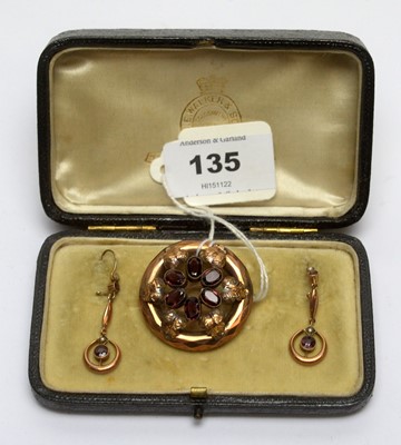 Lot 135 - A Victorian garnet brooch and earrings.