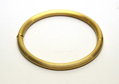 Lot 155 - An 18ct yellow gold bangle