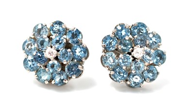 Lot 493 - A pair of diamond and blue topaz cluster earrings