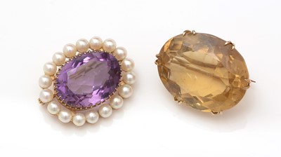 Lot 401 - A citrine brooch and an amethyst and cultured pearl brooch.