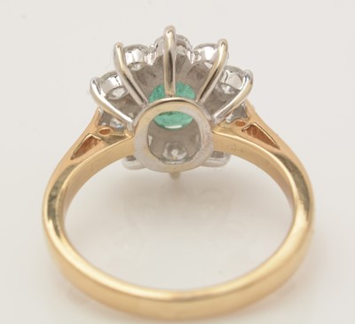Lot 345 - An emerald and diamond cluster ring