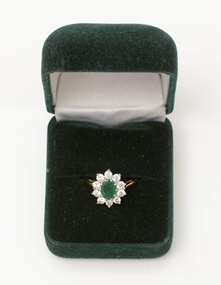 Lot 345 - An emerald and diamond cluster ring