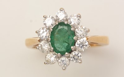 Lot 345 - An emerald and diamond cluster ring