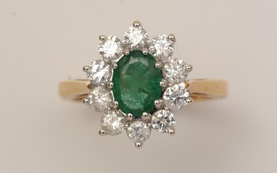 Lot 345 - An emerald and diamond cluster ring