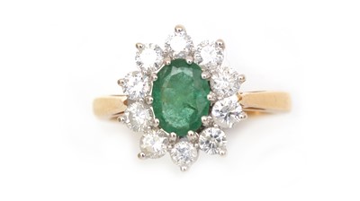 Lot 345 - An emerald and diamond cluster ring