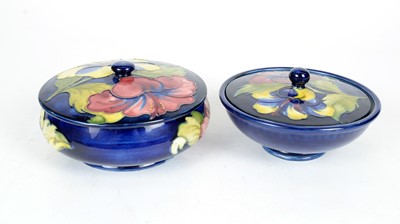 Lot 688 - Two Moorcroft Hibiscus pattern powder bowls and covers.