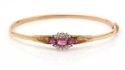 Lot 330 - A ruby and diamond bangle