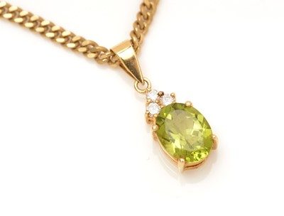 Lot 332 - A peridot and diamond pendant
