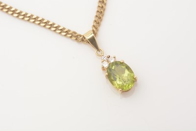 Lot 332 - A peridot and diamond pendant