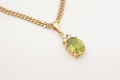 Lot 332 - A peridot and diamond pendant