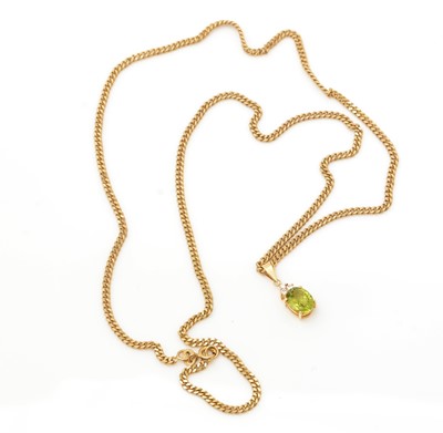Lot 332 - A peridot and diamond pendant
