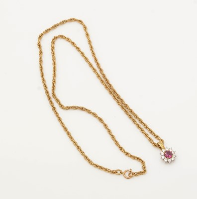 Lot 334 - A ruby and diamond cluster pendant