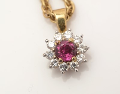 Lot 334 - A ruby and diamond cluster pendant
