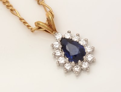 Lot 335 - A sapphire and diamond cluster pendant