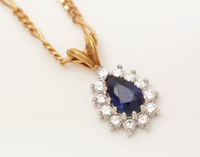 Lot 335 - A sapphire and diamond cluster pendant