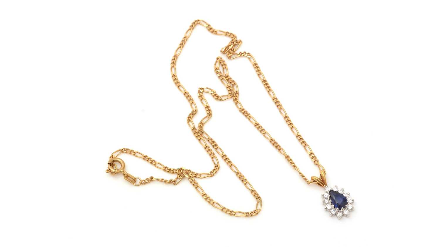 Lot 335 - A sapphire and diamond cluster pendant