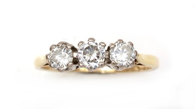 Lot 323 - A three stone diamond ring