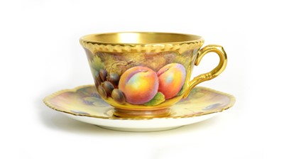 Lot 712 - Fruit painted Worcester teacup and saucer